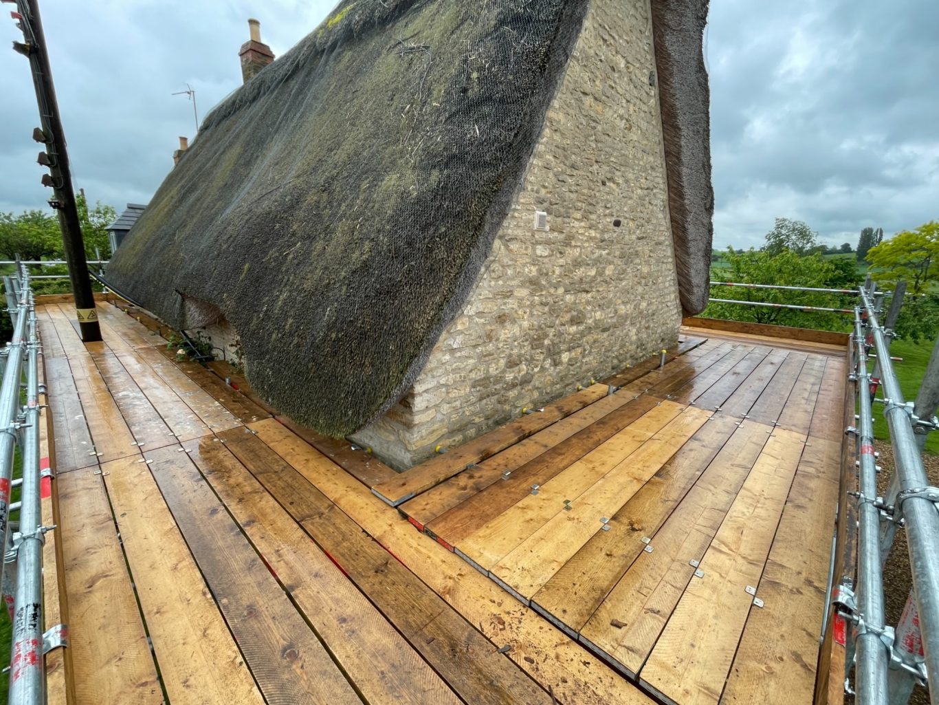 Scaffold platform for new thatched roof in Grendon Scaffold platform for new thatched roof in Grendon